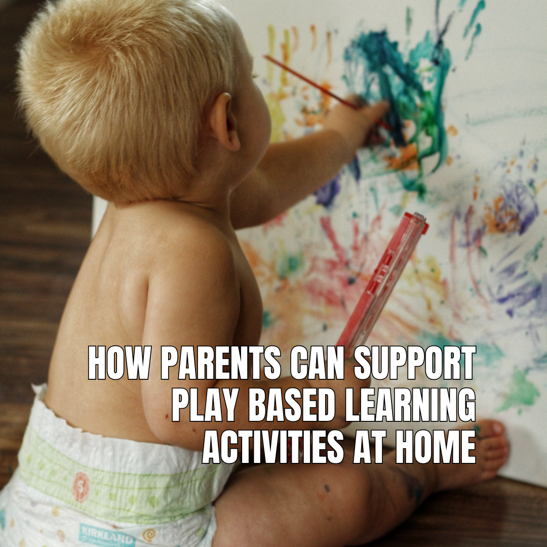 A young child engaged in creative play-based learning by painting on a canvas, demonstrating fine motor skills and independence