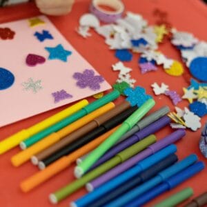 A vibrant assortment of arts and crafts materials on a table, perfect for creativity and decoration projects.