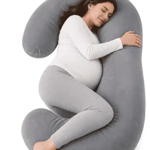 C-shaped pregnancy pillow providing full body support for belly, back, hips and legs during pregnancy