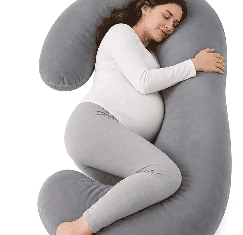C-shaped pregnancy pillow providing full body support for belly, back, hips and legs during pregnancy