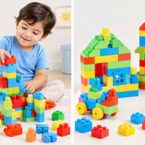 Toddler boy playing with childrens building blocks, stacking a colourful tower
