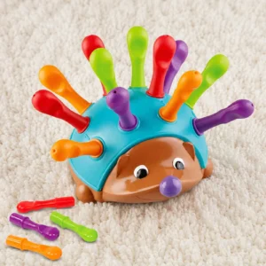 : Pull out spike toy hedgehog fully assembled with colourful spikes on a carpet background