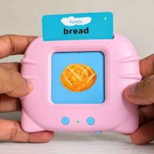 Pink card reader toy held in both hands, a blue “foods: bread” card poking out of the top and a bread bun picture on the screen
